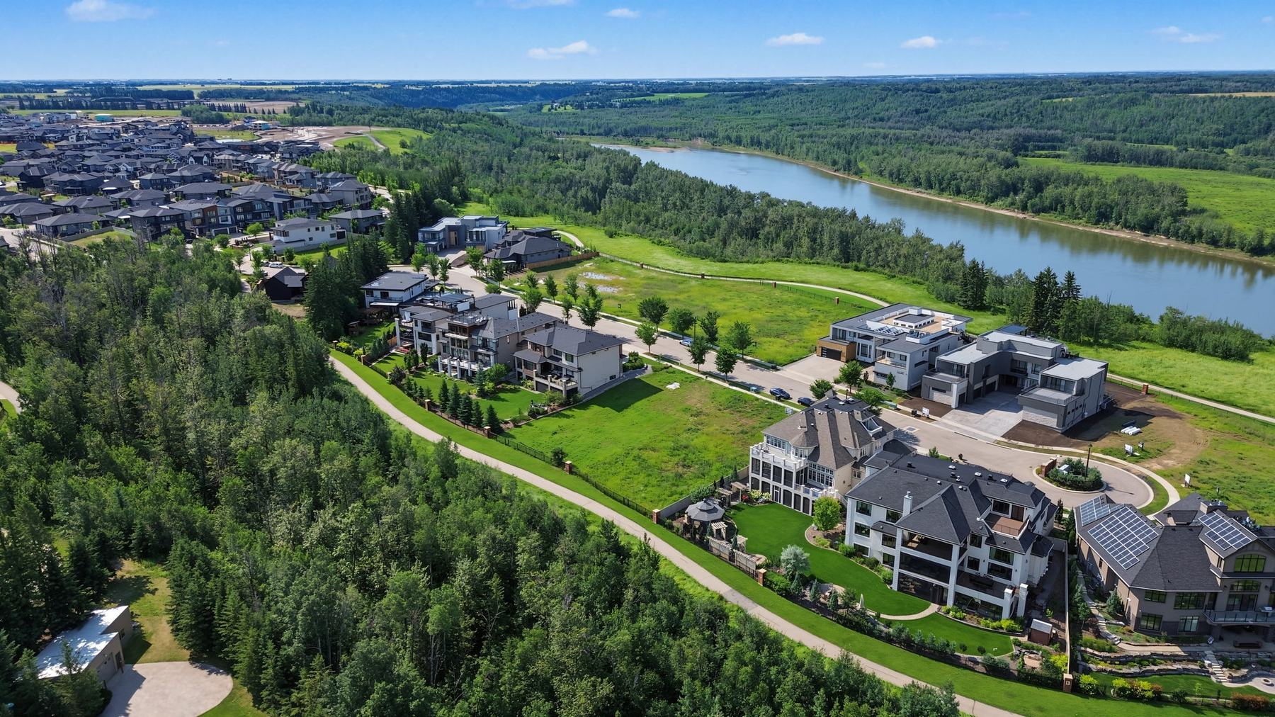 The enclave seen from above with the North Saskatchewan River curving through the valley behind it.