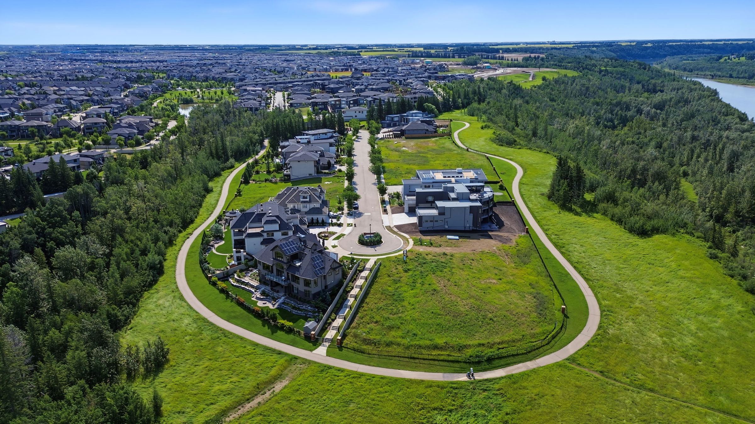 Aerial view of The Banks at Hendriks Pointe, an estate enclave set in a green bowl above the North Saskatchewan River valley in southwest Edmonton.